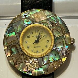 L A Express Mother of Pearl Watch, featuring a round face and a leather band